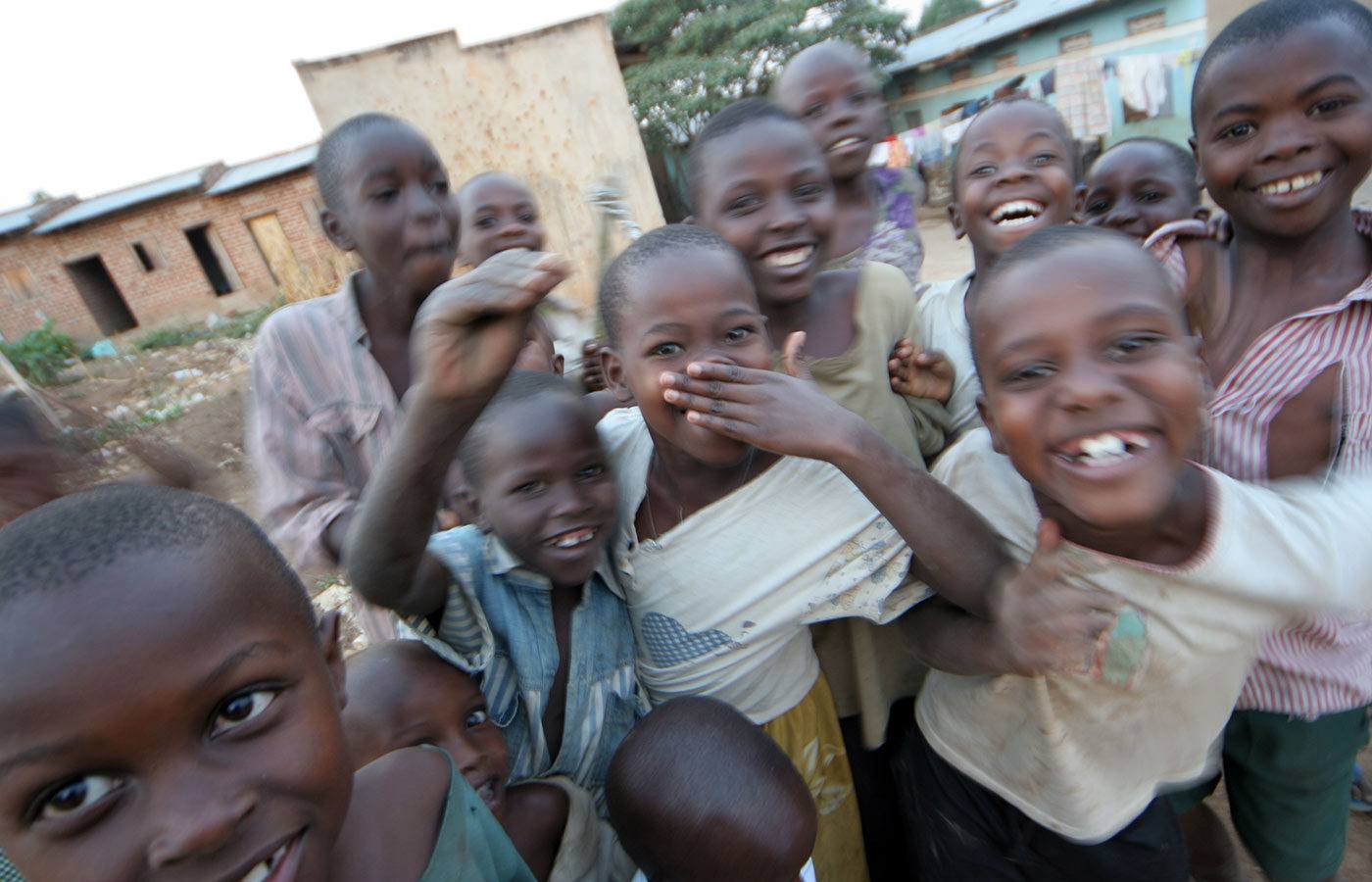 a group of smiling children in a developing country