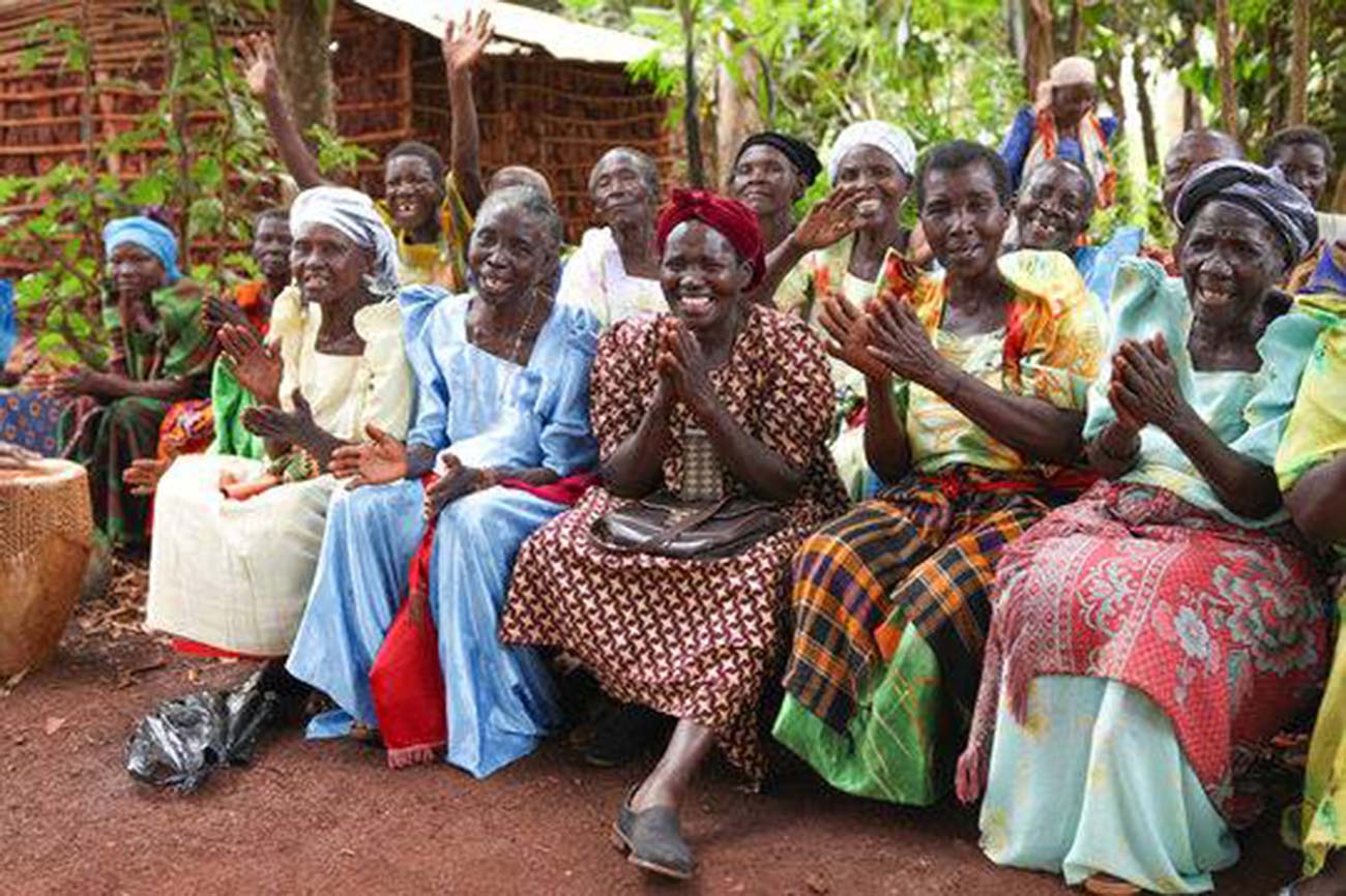 elderly women smiling and clapping as a part of the Grandmothers Initiative