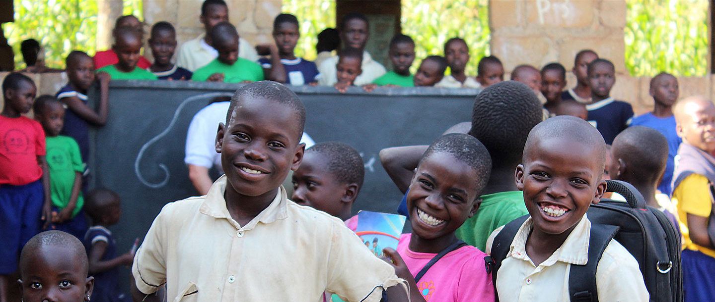 a group of smiling schoolchildren in Kenya