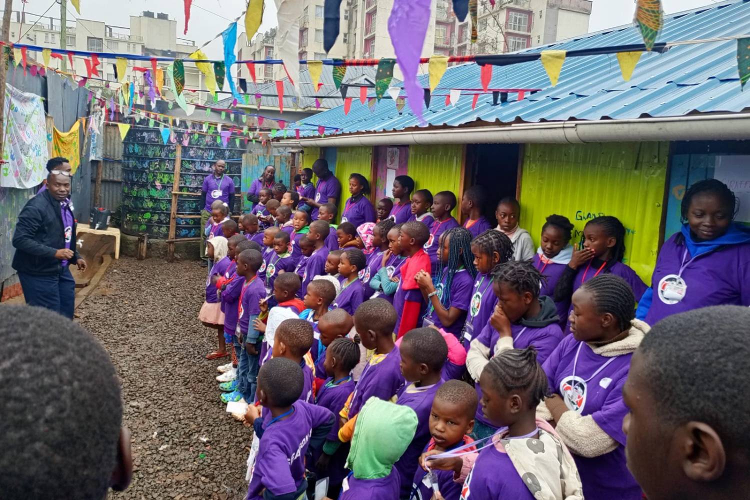 a man addressing a group of children