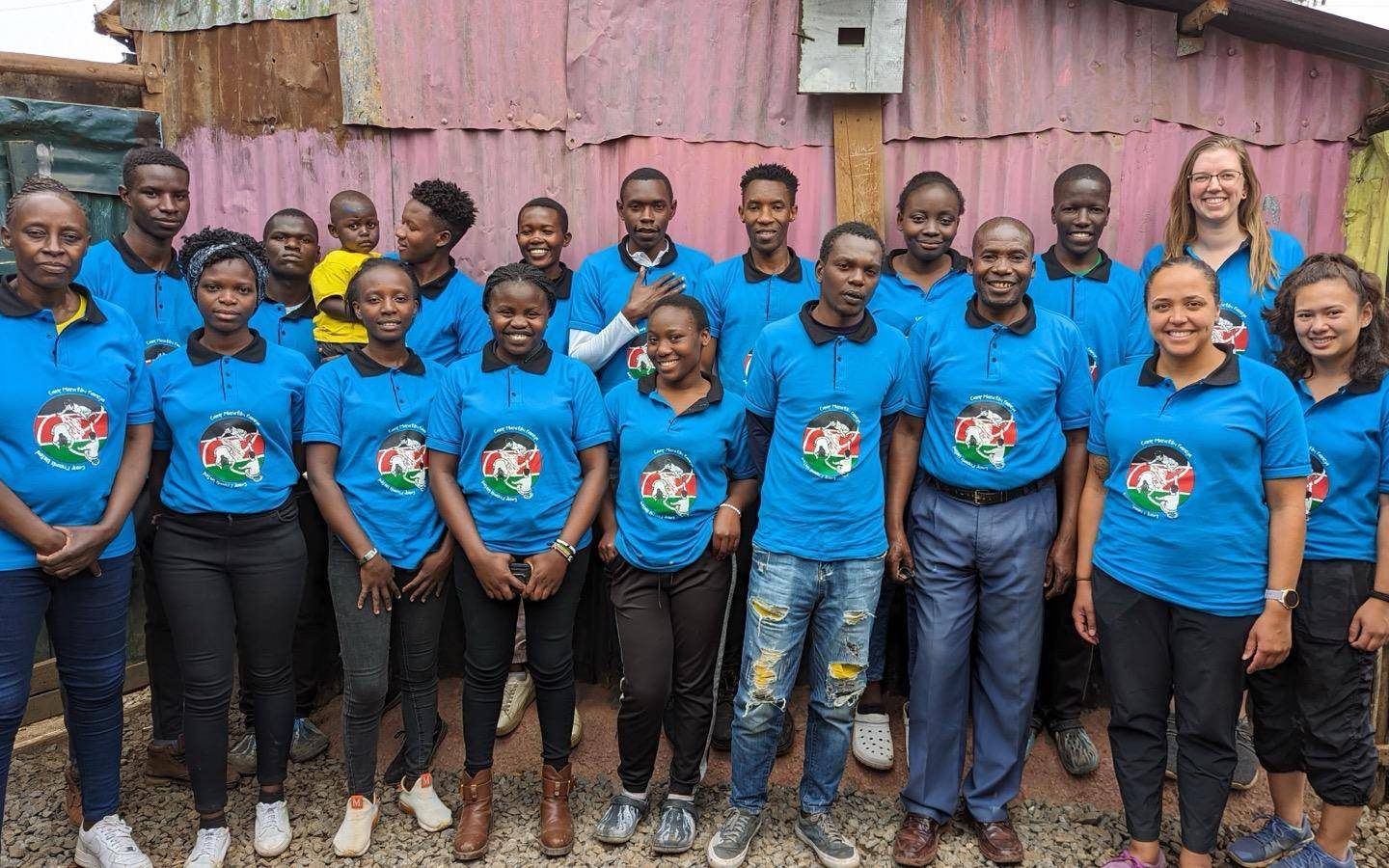 a group of people standing next to each other